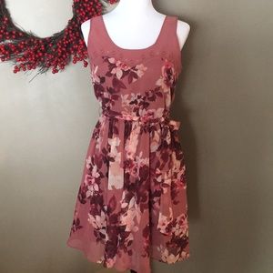 Pink floral print flowing dress.